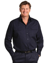 A man wearing a navy long-sleeve cotton work shirt with two front pockets and a button-down collar.