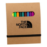 A notepad set featuring a brown cardboard cover with a logo and a collection of vibrant colouring markers inside.