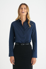 A ladies long sleeve button-up shirt in navy, featuring a collar and a sleek fit, complemented by a belt.