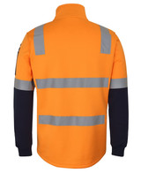 A fleecy 1/2 zip sweater in bright orange and navy with reflective strips and a logo on the sleeve.