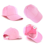 A pink kids cap featuring a curved brim, adjustable strap, and a branded tag inside.