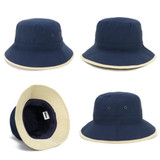 A navy microfibre bucket hat with a cream trim, featuring interior lining and a logo.