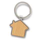 A house-shaped key ring with a wooden centre and a silver metal border. The key ring also has a circular attachment.