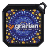 A square Bluetooth speaker with a vibrant circular pattern in blues, yellows, and oranges, featuring a logo.