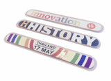 Three nail files featuring various designs, including colours of blue, red, and stripes, with a logo on each.