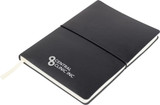 A black Tango A5 notebook with a white logo, featuring an elastic closure and a ribbon bookmark.