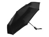 A black fold-up umbrella featuring a sleek design and a handle with a logo.