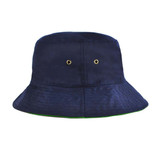 A reversible bucket hat in navy blue with green lining and metal eyelets for ventilation. It features a logo.