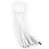 A white charging cable with a cube-shaped connector and multiple branching cords in a neat arrangement.