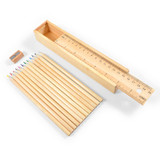 A set of wooden coloured pencils in various colors, a sharpener, and a measuring ruler all in a wooden box.