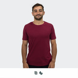 A unisex TRENDSWEAR Element t-shirt in burgundy, featuring a logo, worn by a smiling model.