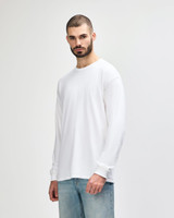 A white long sleeve T-shirt for adults, featuring a simple design and a logo on the front.