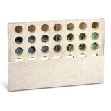 A Four in a Row game in a cream-coloured frame with multiple holes for game pieces.