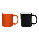 A set of two coffee mugs, one orange and one black, each with a handle and a glossy finish.