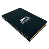 A black spiral notebook with a logo on the front and yellow edges.