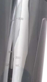 A drink bottle in black with measurement markings up to 500 ml. The design features a logo.