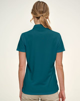 A teal women's polo shirt with a jacquard knit design, featuring a collar and short sleeves.