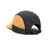 A black and orange 8-panel cap with a curved brim and adjustable strap at the back, featuring a logo.
