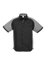 A black and grey short sleeve button-up shirt with a logo on the chest and contrasting panel details.