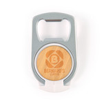 A drink bottle opener phone stand in silver and wood, featuring a circular design with a logo.