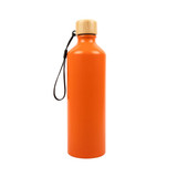 A drink bottle in vibrant orange with a bamboo lid and a black wrist strap. It features a logo.