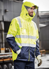 A waterproof jacket in high visibility yellow and navy, featuring reflective strips and a hood. It has a logo.