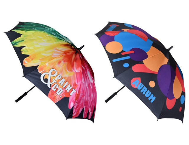 A golf umbrella featuring a vibrant floral design in multiple colours on one side and bold geometric shapes on the other.