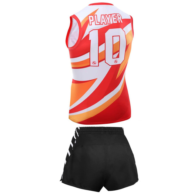 A red AFL jersey with a colourful design and the number 10, paired with black shorts. Features a branding logo.