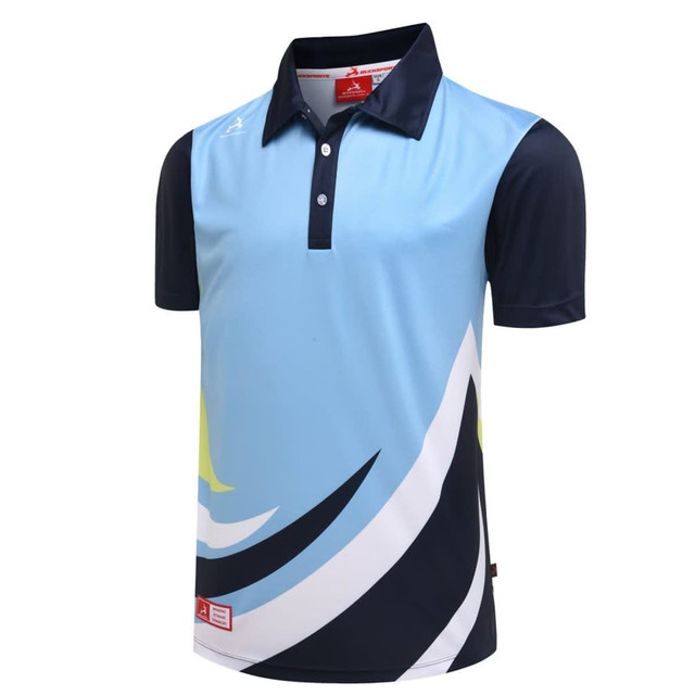 A polo shirt featuring a light blue front with navy sleeves and abstract black and yellow designs. It has a logo.