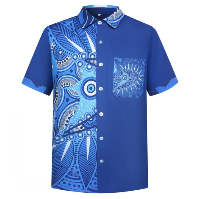 A short-sleeved blue shirt featuring intricate blue patterns and a pocket on the front. The shirt has a button-down collar.