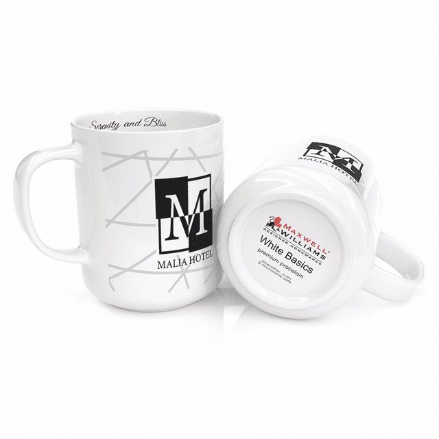 A white coffee mug featuring a logo, shown upright and tipped over, with a glossy finish.