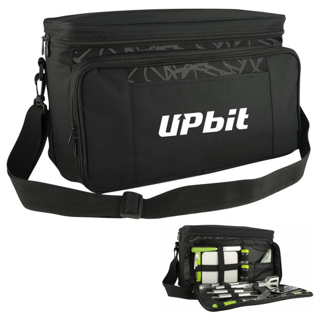 A black picnic bag with a shoulder strap, featuring compartments for utensils and tools, and a logo on the front.