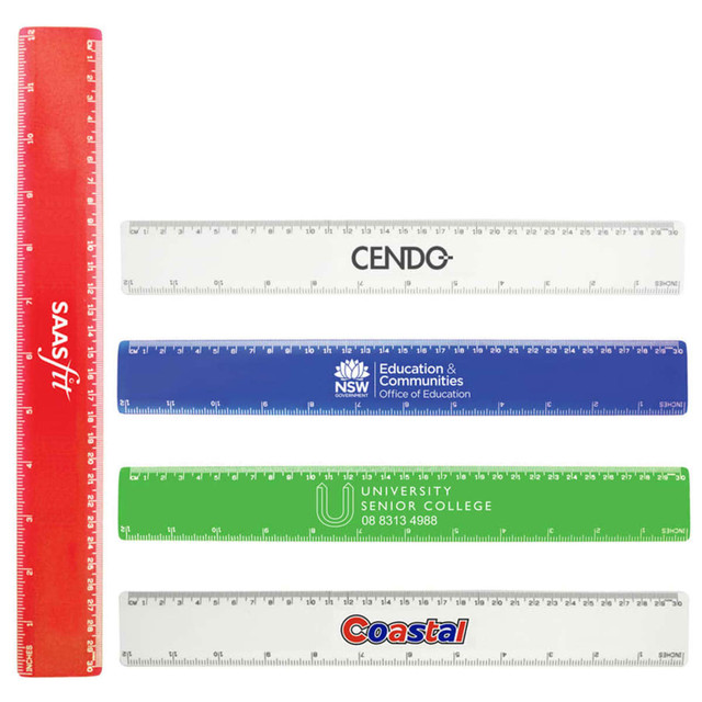 A set of plastic rulers in red, blue, green, and clear, featuring various branding and measurement markings.