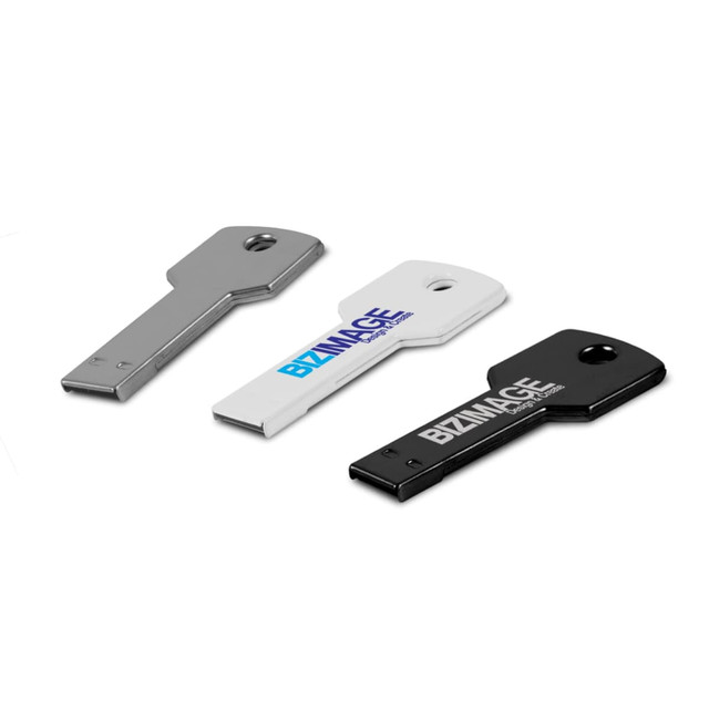 Three USB flash drives in metallic, white, and black colours, with a key-like design and logos on some of them.