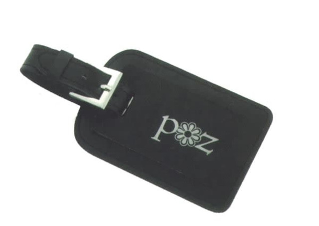 A black leather luggage tag featuring a silver buckle and a floral logo.