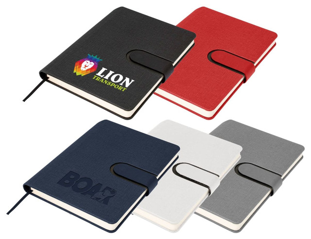 A set of A5 notebooks in red, navy, grey, and white, featuring discreet logo designs and elastic closures.