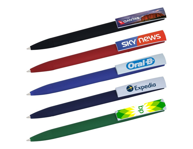 A selection of plastic pens in black, red, blue, and green, featuring various logos and branding on the barrels.
