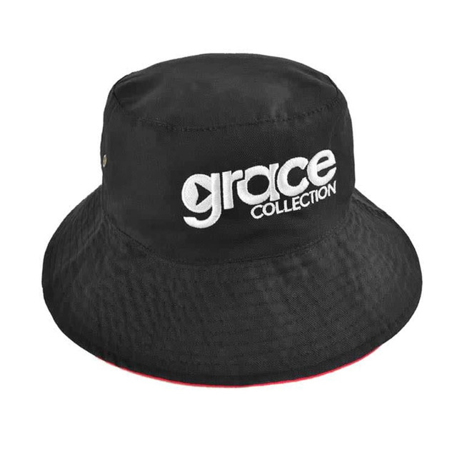 A reversible bucket hat in black with an adjustable toggle and a logo on the front.