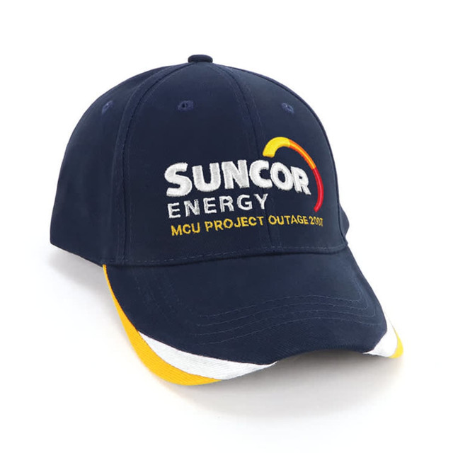 A navy blue cap with a multicoloured peak and a logo featuring text and design elements.
