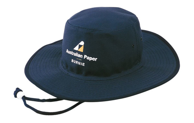 A navy canvas hat featuring a wide brim and an adjustable chin strap. It has a logo on the front.