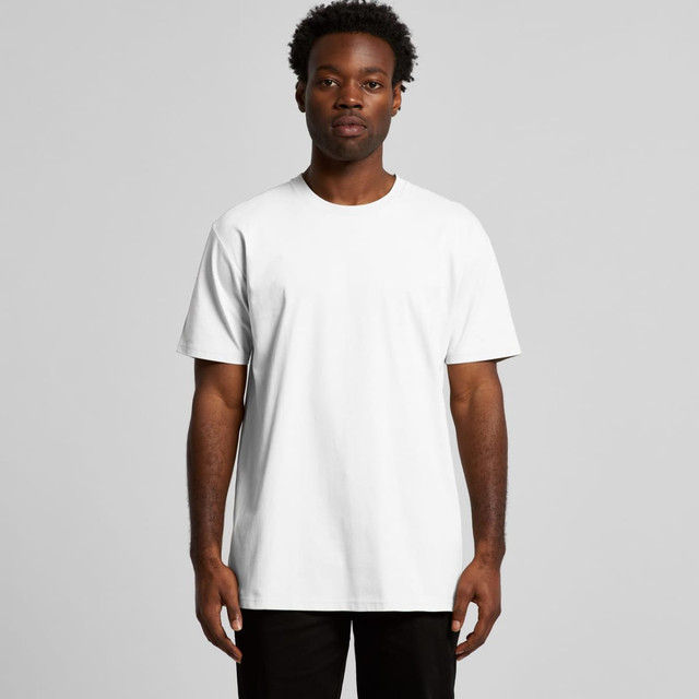A man is wearing a plain white T-shirt with a relaxed fit. The shirt includes a logo.