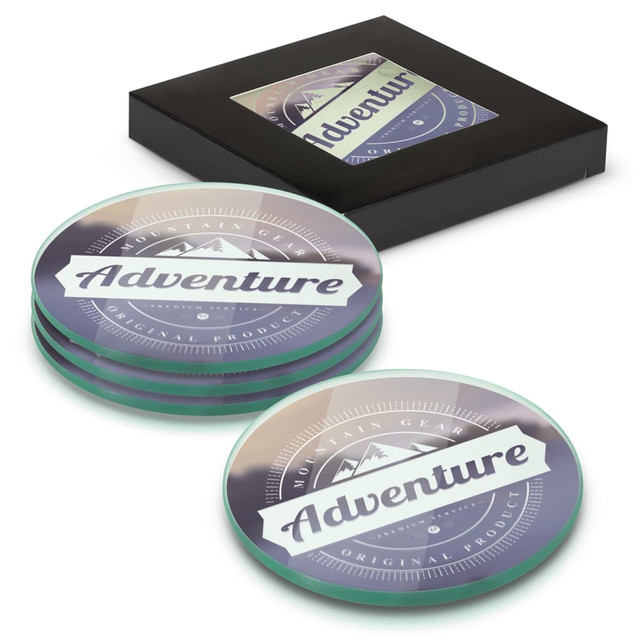 A set of four round glass coasters in various colours, displayed in a black box with a logo.