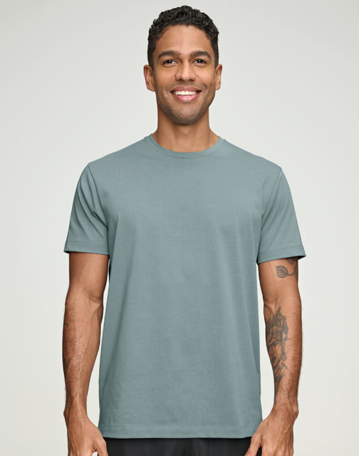 A men's premium cotton short-sleeve tee shirt in a light teal colour, featuring a logo on the front.