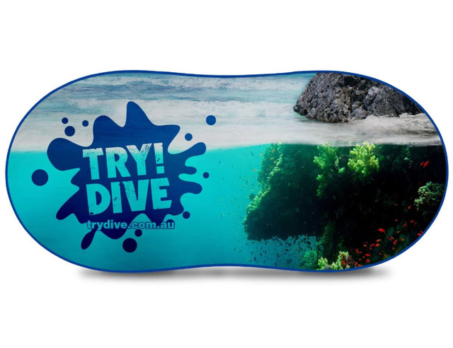 A full-colour auto sunshade featuring an underwater scene with vibrant fish and a rocky landscape. It has a logo.