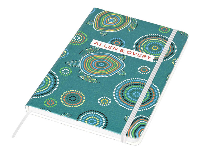 A full-colour A5 notebook with a vibrant teal design featuring circular patterns and a branded logo.