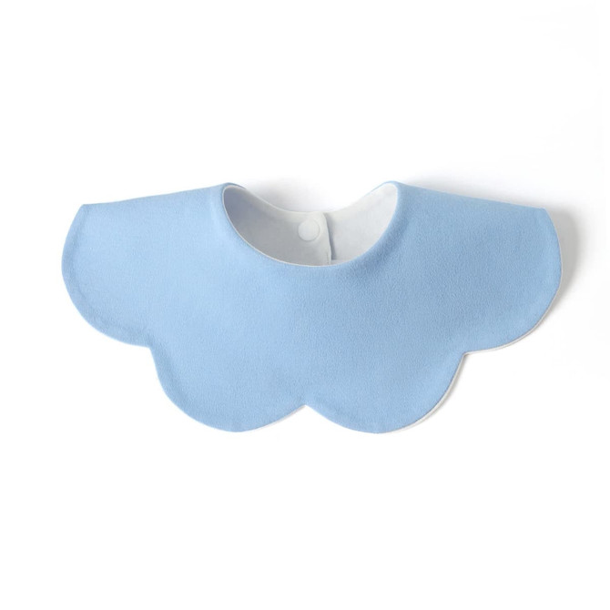 A blue, scalloped-edge bib made from 100% organic cotton with a button fastener at the back.