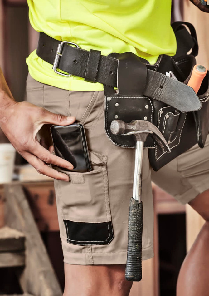 Men's summer cargo shorts in khaki, featuring pockets and a belt, complemented by a tool belt with tools.