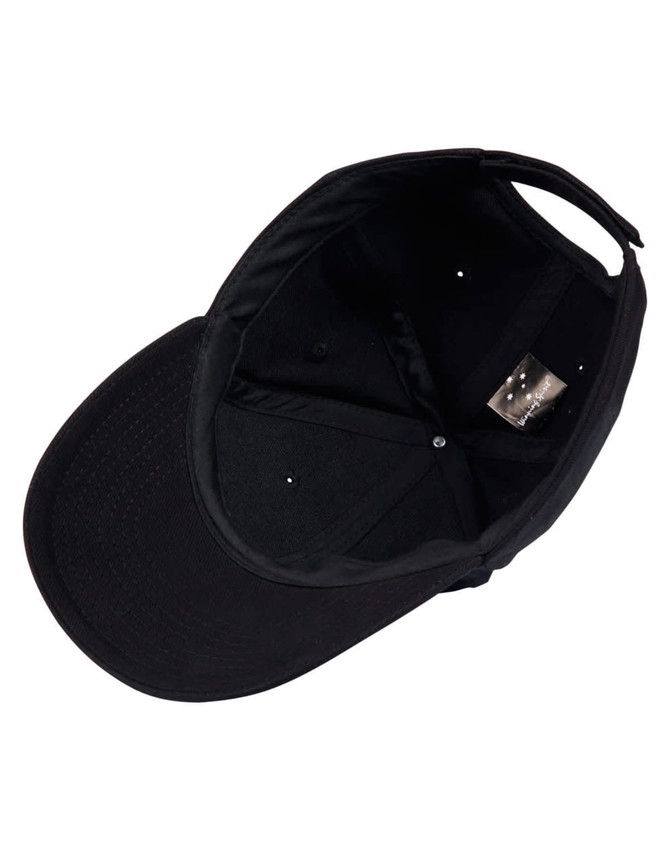 A black heavy brushed cotton cap featuring an internal label and ventilation holes.