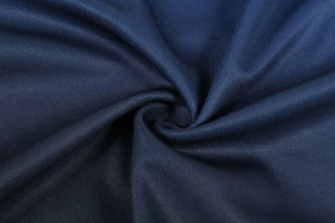 A close-up of navy fabric, featuring a textured weave, suitable for sports uniforms.