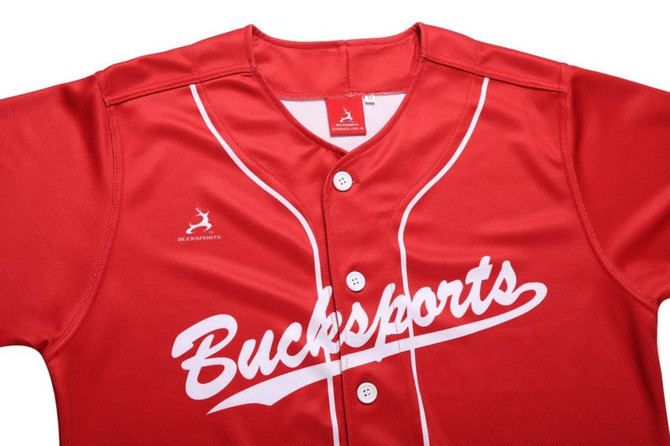 A red full button baseball tee featuring white detailing and a logo on the upper left side.